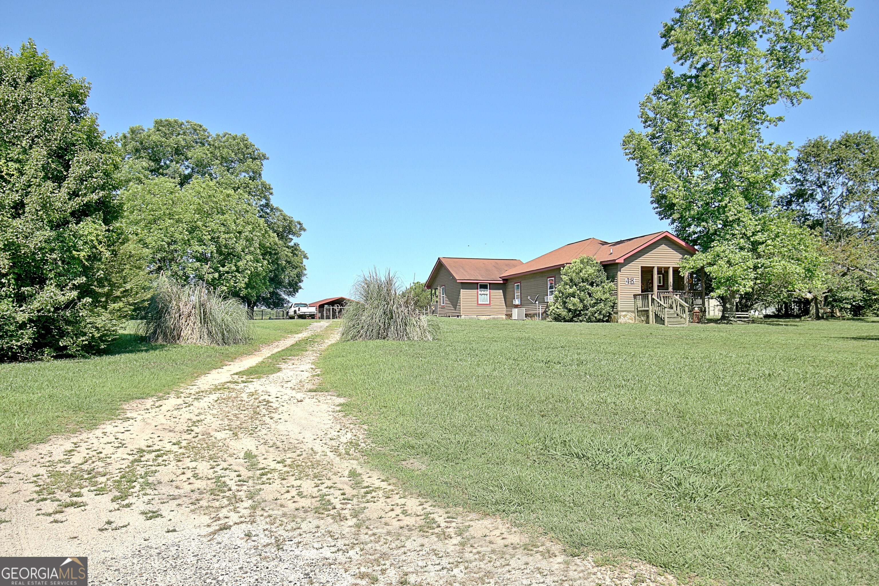 48 Riveree Road Brooks, GA 30205 - Photo 1 of 1 a view of a garden with trees