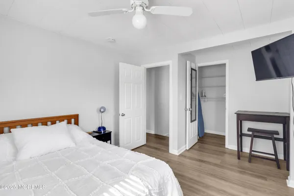 a bedroom with a bed and a chair