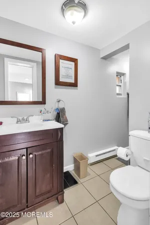 a living room with furniture a wooden floor and a window