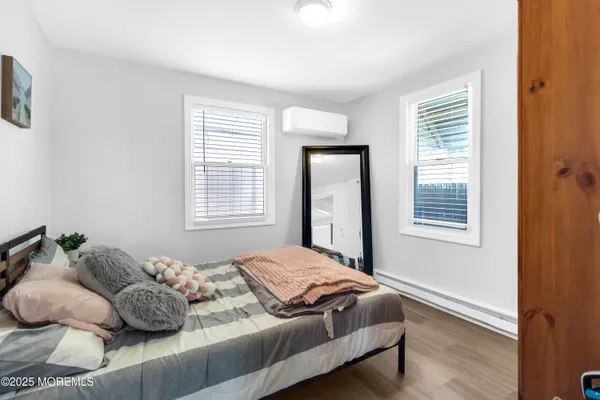 a view of a house with patio and a yard