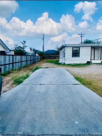 a view of a backyard of the house