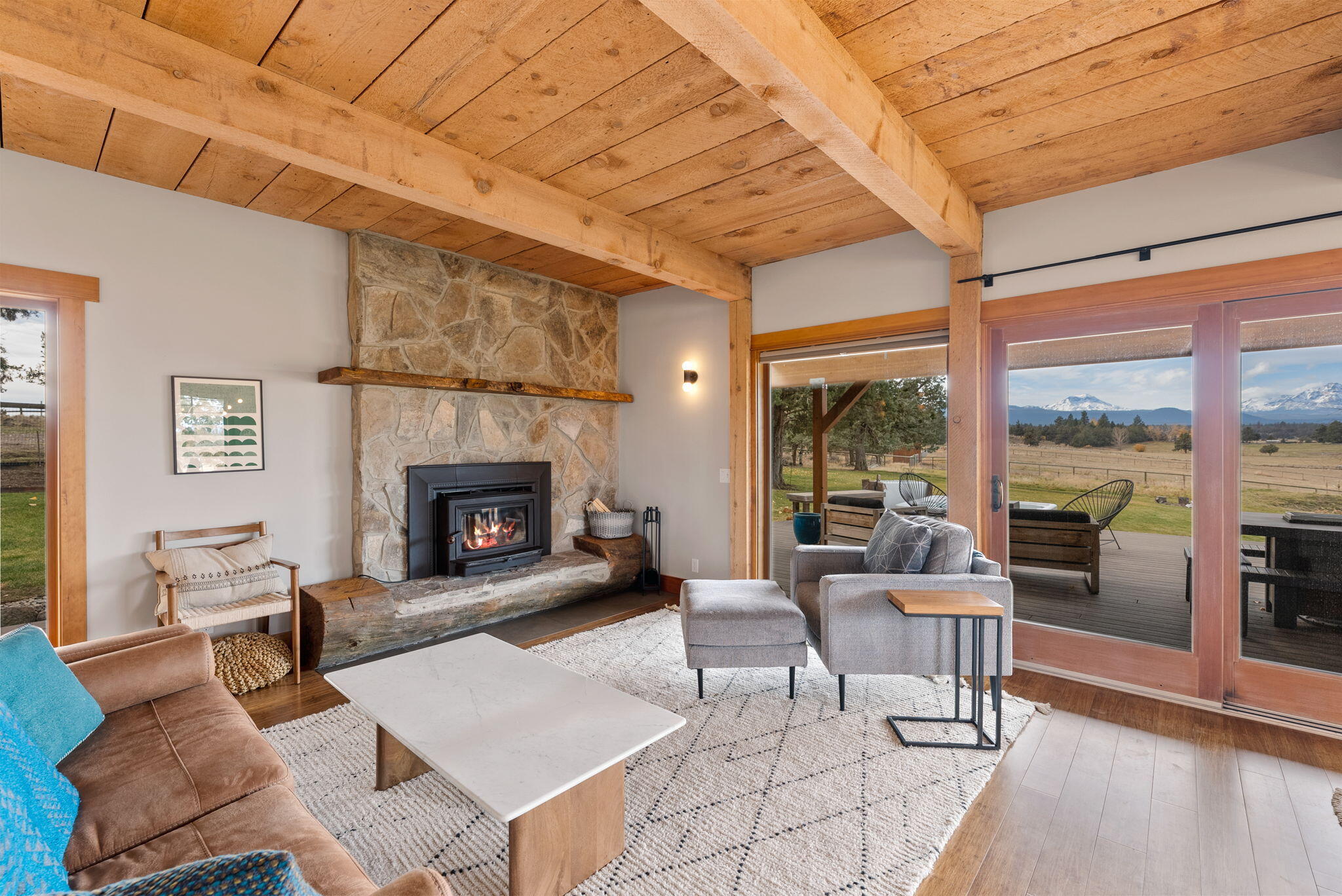65345 Tweed Road Bend, OR 97703 - Photo 24 of 90 a living room with furniture a fireplace and a table