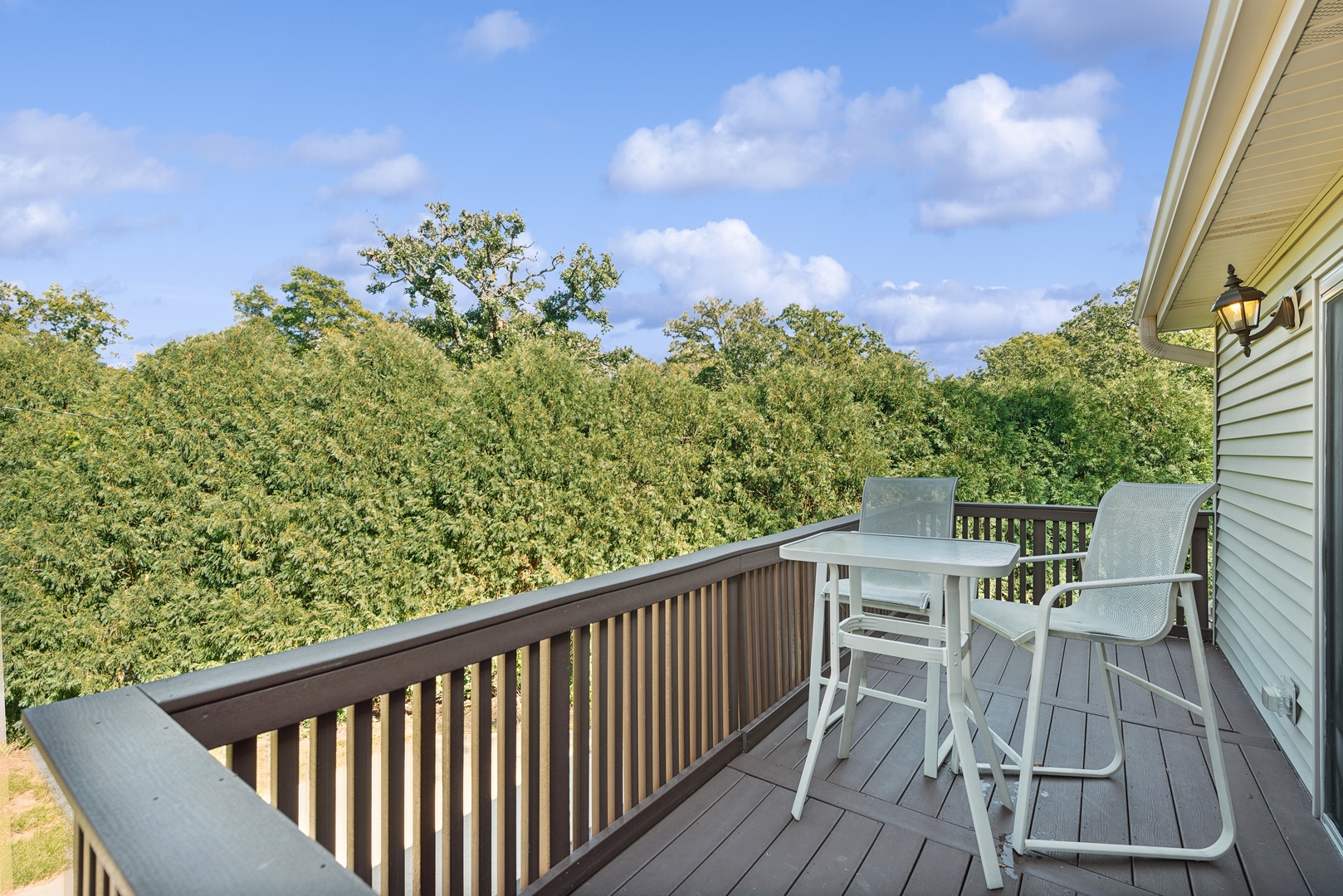 4612 Blue Jay Road Harvard, IL 60033 - Photo 12 of 14 a balcony with wooden floor and fence