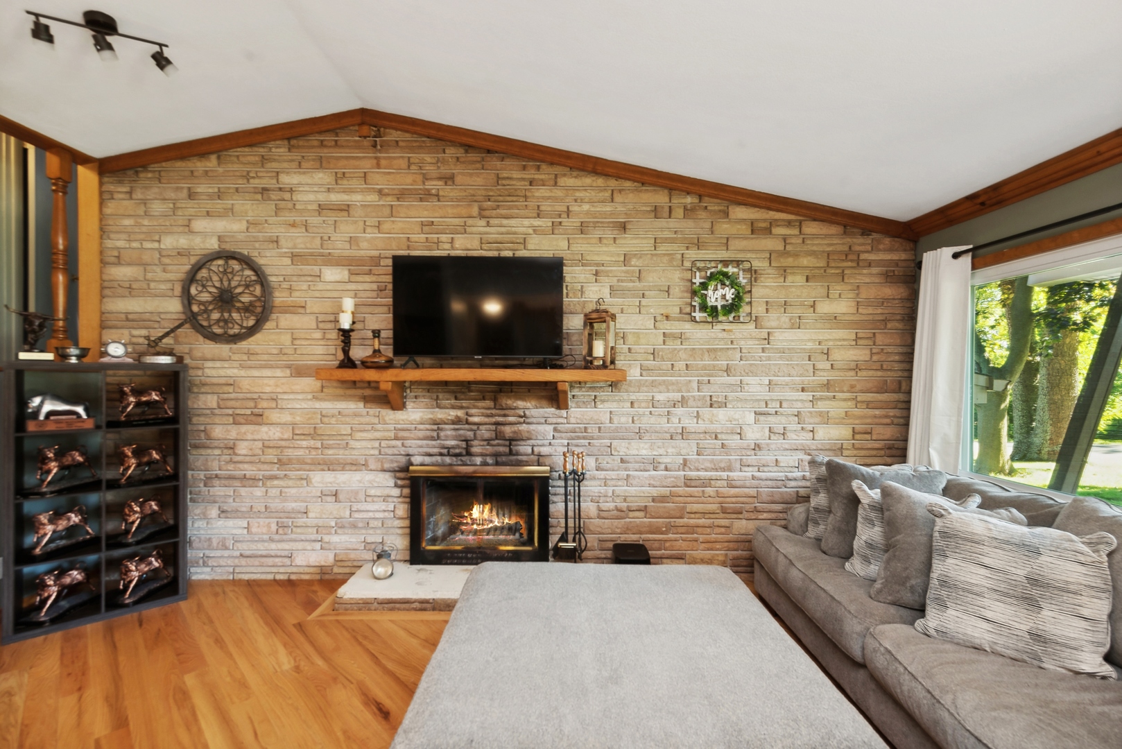 4612 Blue Jay Road Harvard, IL 60033 - Photo 3 of 14 a living room with fireplace furniture and a flat screen tv