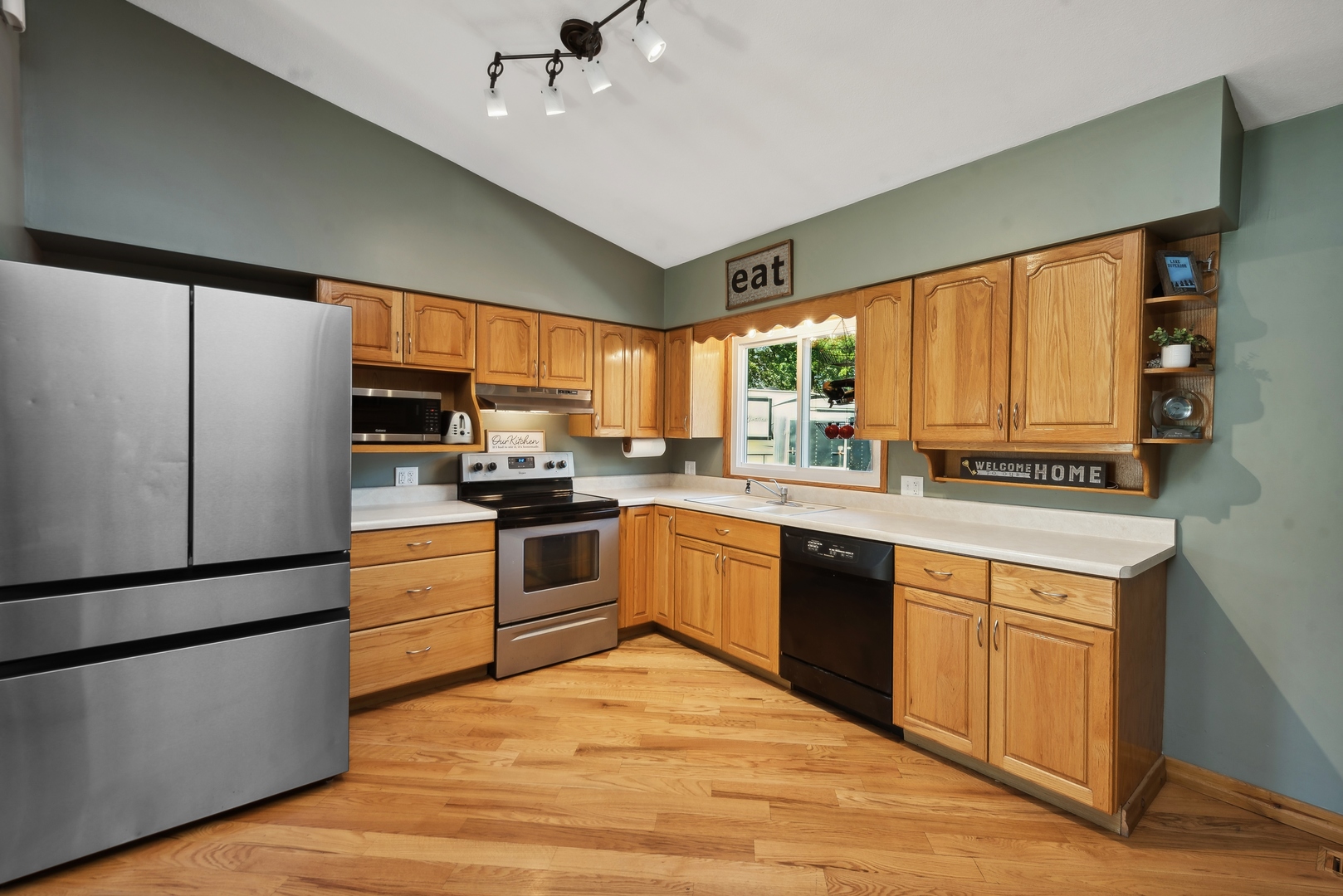 4612 Blue Jay Road Harvard, IL 60033 - Photo 5 of 14 a kitchen with a refrigerator window and sink