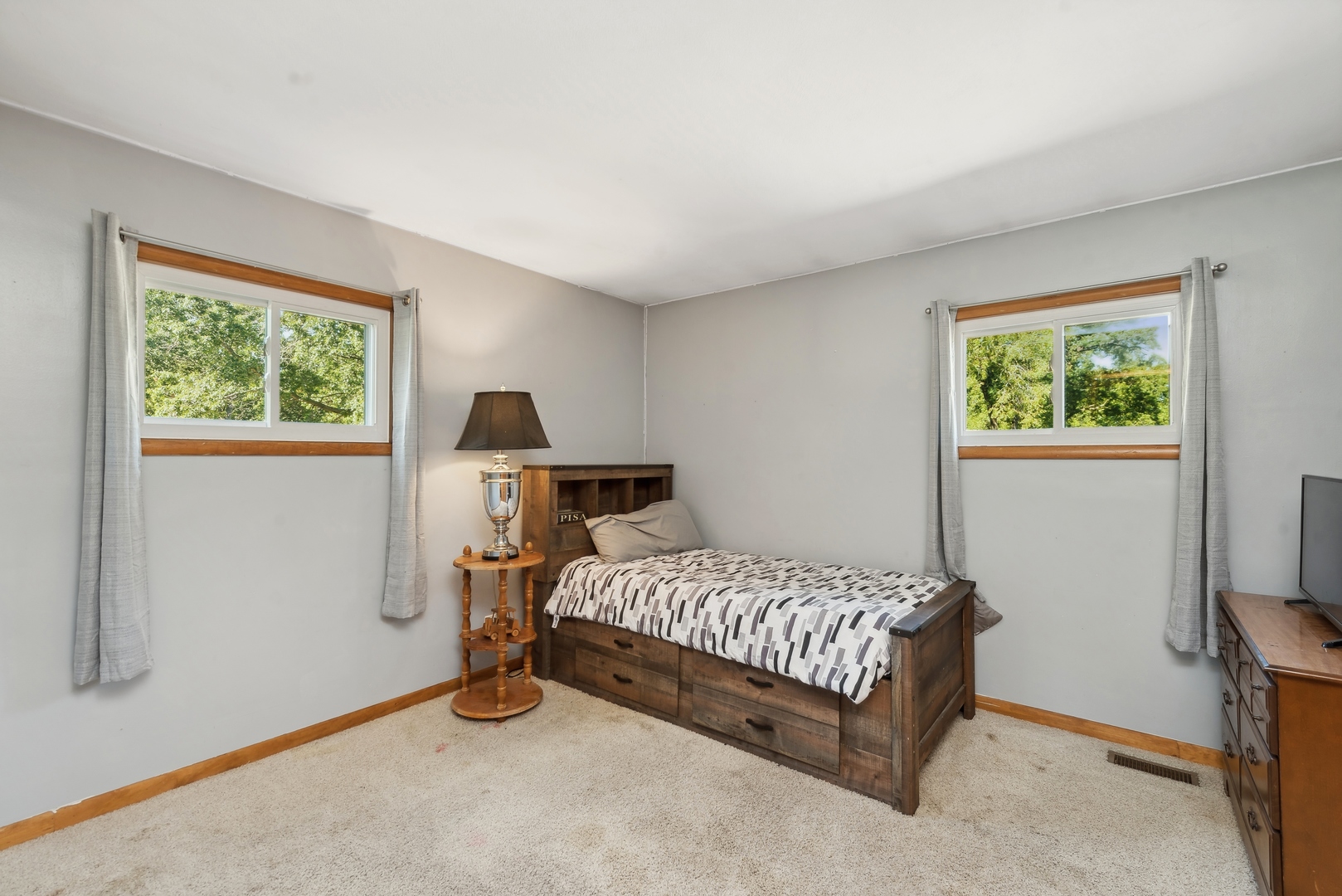 4612 Blue Jay Road Harvard, IL 60033 - Photo 9 of 14 a bedroom with a bed and a window