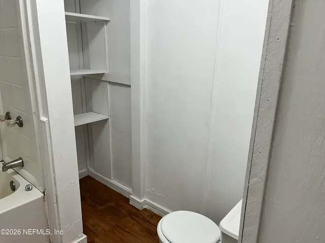 a bathroom with a toilet and a sink