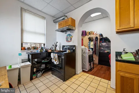 a kitchen with a refrigerator and dishwasher