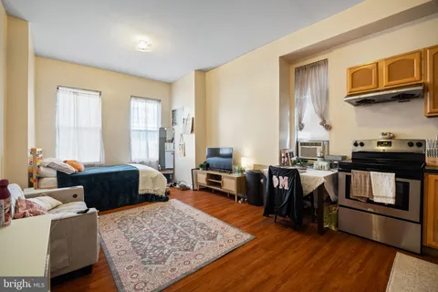 a kitchen with stainless steel appliances granite countertop a refrigerator and stove