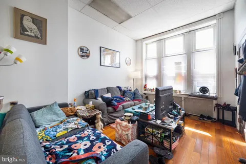 a bed room with furniture and a window
