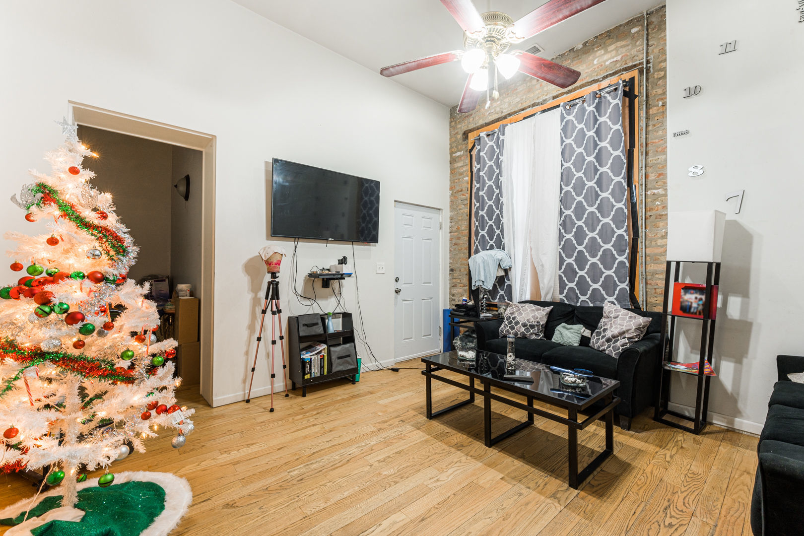 2008 South Pulaski Road Chicago, IL 60623 - Photo 4 of 16 a living room with furniture and a flat screen tv