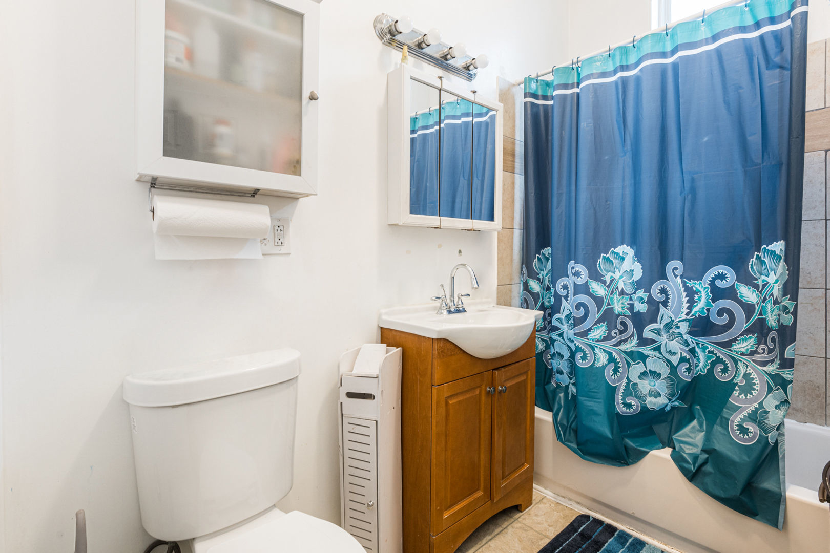 2008 South Pulaski Road Chicago, IL 60623 - Photo 7 of 16 a bathroom with a sink toilet and mirror