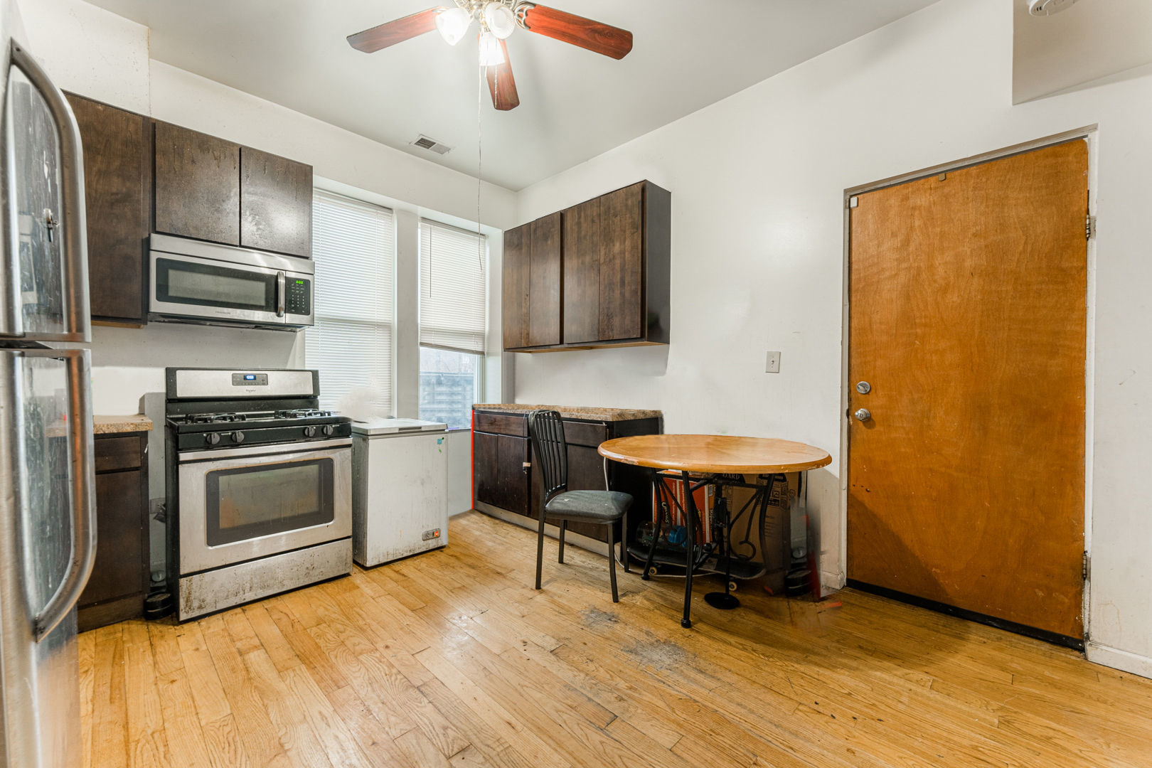 2008 South Pulaski Road Chicago, IL 60623 - Photo 9 of 16 a kitchen with stainless steel appliances granite countertop a stove and a refrigerator