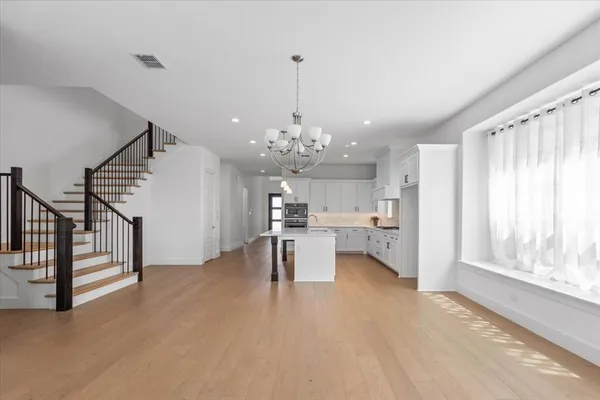 a view of a living room and chandelier in a room