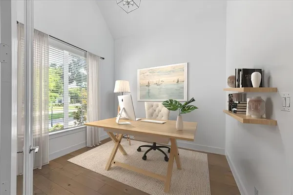 a workspace with furniture and a window