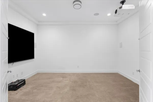 a view of an empty room with a flat screen tv