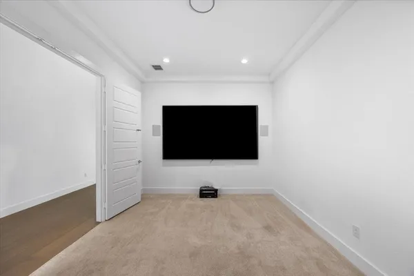 a living room with a flat screen tv