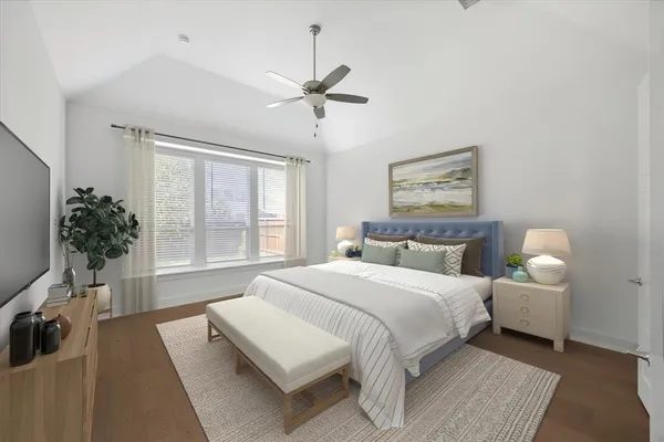 a spacious bedroom with a bed and a window