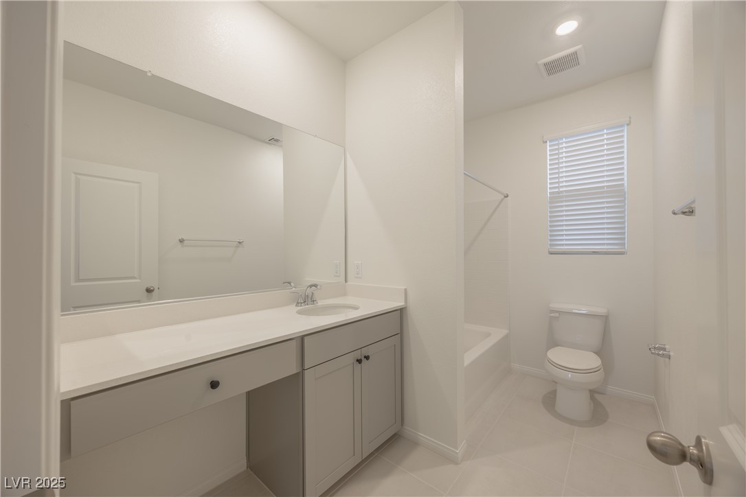 95 Silver Run Lane Las Vegas, NV 89138 - Photo 8 of 18 Bathroom featuring vanity, light tile patterned flooring, tub / shower combination, and recessed lighting