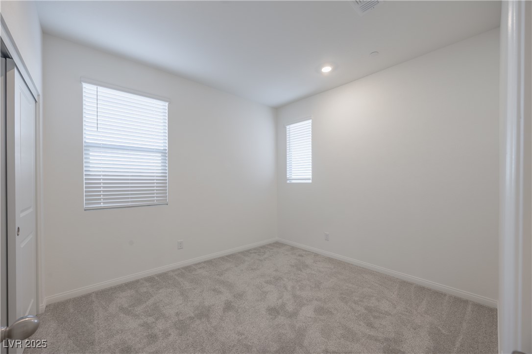 95 Silver Run Lane Las Vegas, NV 89138 - Photo 9 of 18 Unfurnished bedroom with light carpet, a closet, and recessed lighting