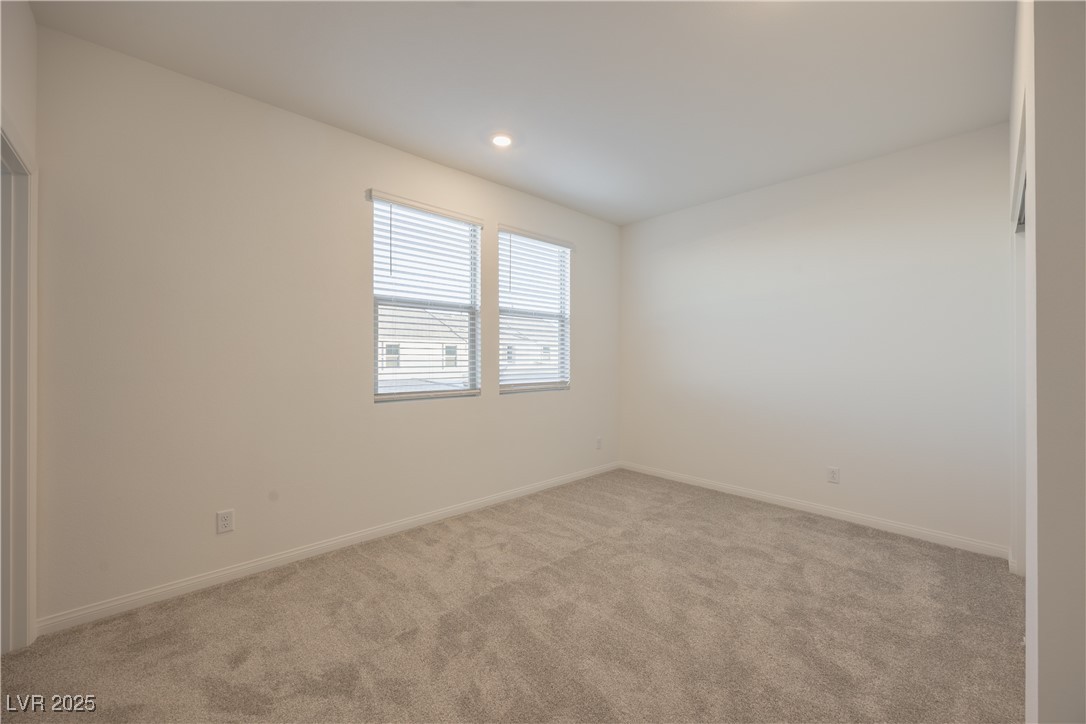 95 Silver Run Lane Las Vegas, NV 89138 - Photo 10 of 18 Spare room with light colored carpet and recessed lighting
