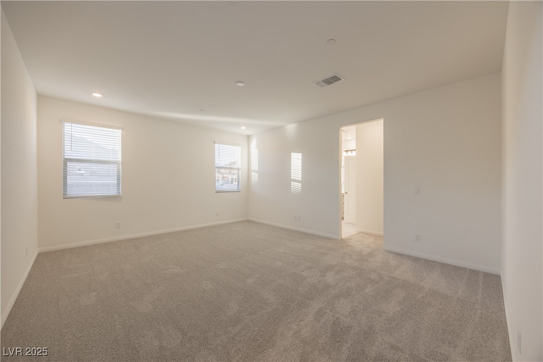 95 Silver Run Lane Las Vegas, NV 89138 - Photo 11 of 18 Unfurnished room with light carpet and recessed lighting