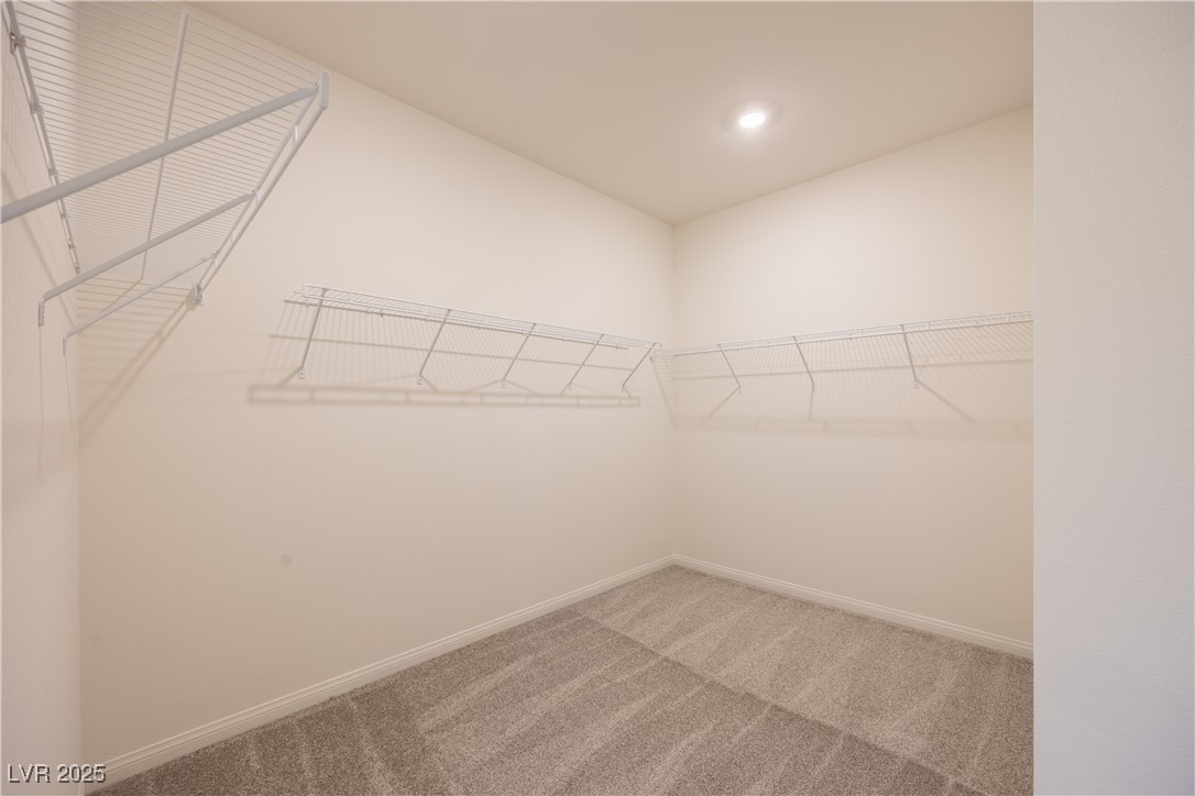 95 Silver Run Lane Las Vegas, NV 89138 - Photo 13 of 18 Spacious closet with light colored carpet