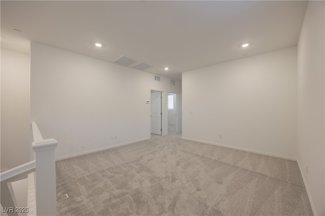 95 Silver Run Lane Las Vegas, NV 89138 - Photo 5 of 18 Spare room with carpet flooring and recessed lighting