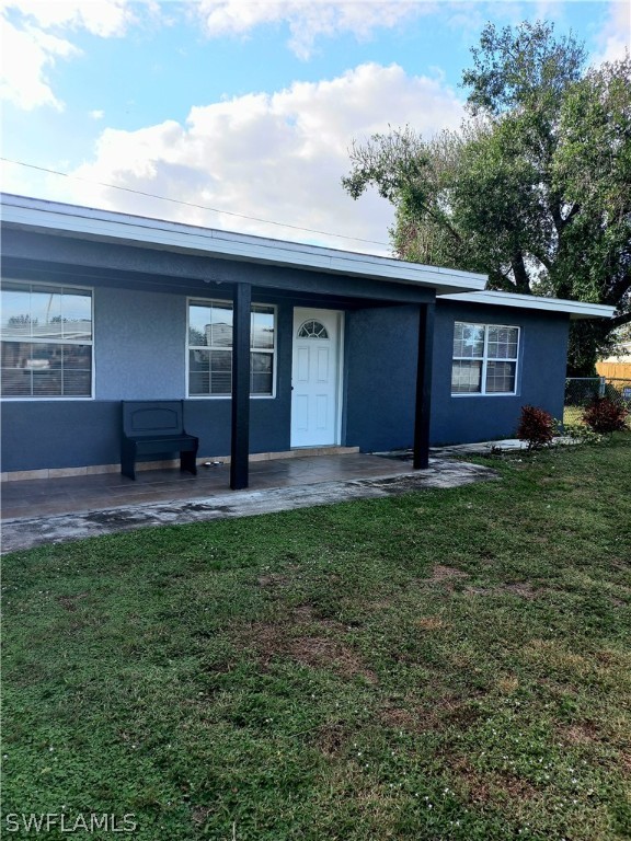 101 Oregon Road North Lehigh Acres, FL 33936 - Photo 1 of 41 a house view with a garden space
