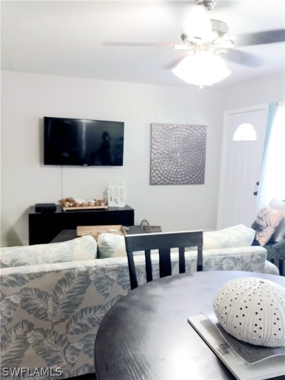 101 Oregon Road North Lehigh Acres, FL 33936 - Photo 21 of 41 a living room with furniture and a flat screen tv