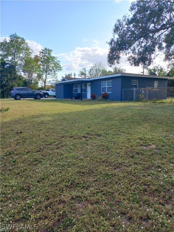 101 Oregon Road North Lehigh Acres, FL 33936 - Photo 8 of 41 a yard with wooden fence