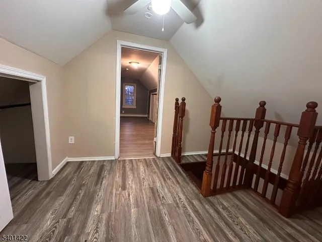 a view of a hallway view with staircase