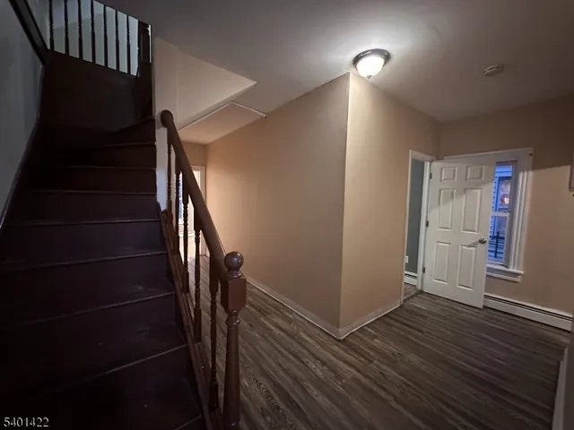 a view of entryway with wooden floor