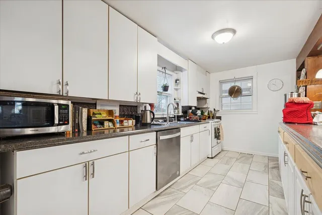 a bathroom with a shower and a glass door