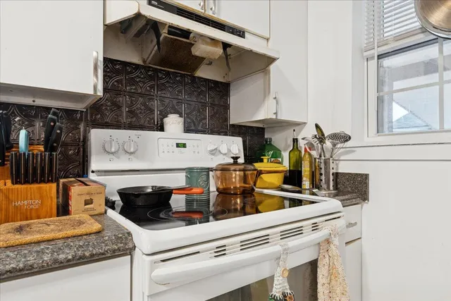 a view of an empty room and wooden floor