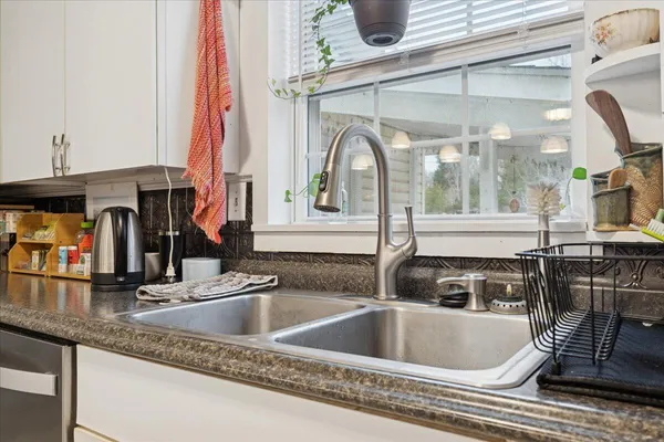 a view of an empty room and wooden floor
