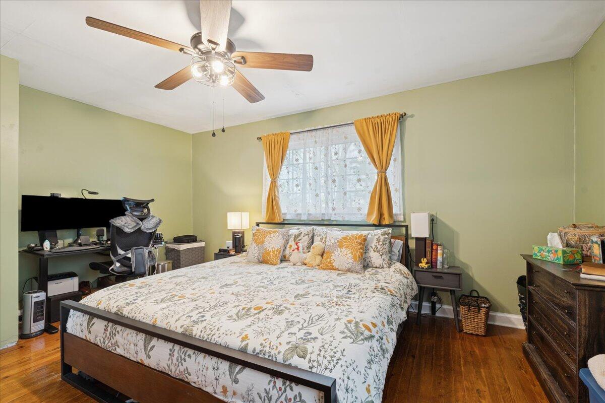 5930 Edwardsville Road Hardy, VA 24101 - Photo 18 of 63 a bedroom with a bed and a chandelier