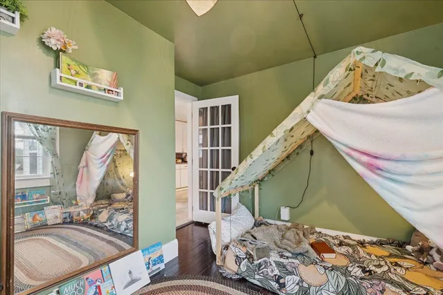 a view of a lake with lawn chairs