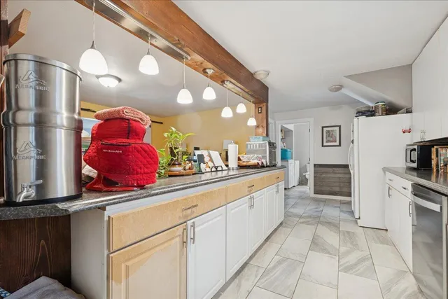 a bathroom with a sink and a window