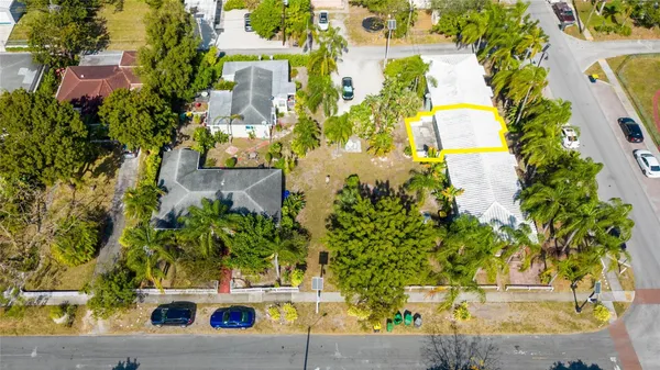 an aerial view of a residential apartment building with a yard