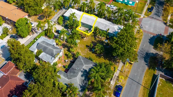 an aerial view of houses with yard