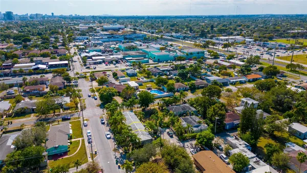 an aerial view of residential houses with outdoor space
