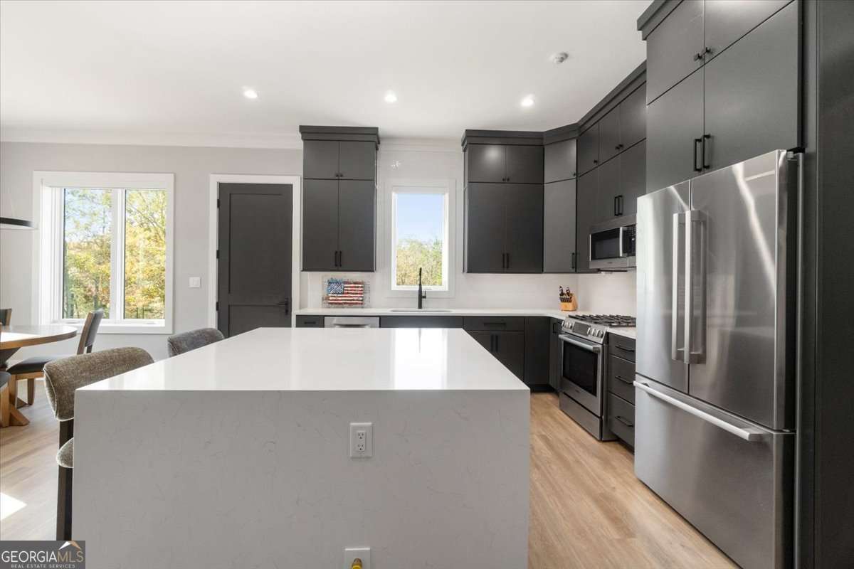 60 Stephens Road Lexington, GA 30648 - Photo 11 of 60 a large kitchen with a large window and stainless steel appliances