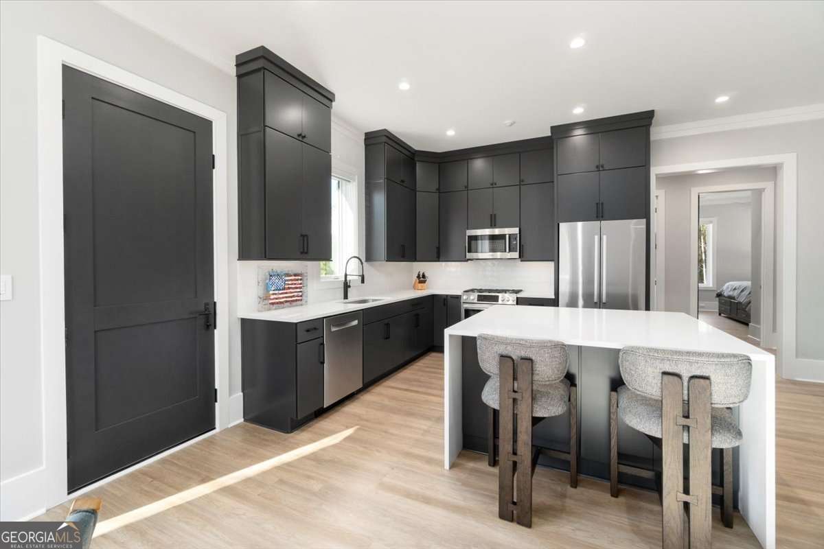 60 Stephens Road Lexington, GA 30648 - Photo 14 of 60 a large kitchen with a table and chairs