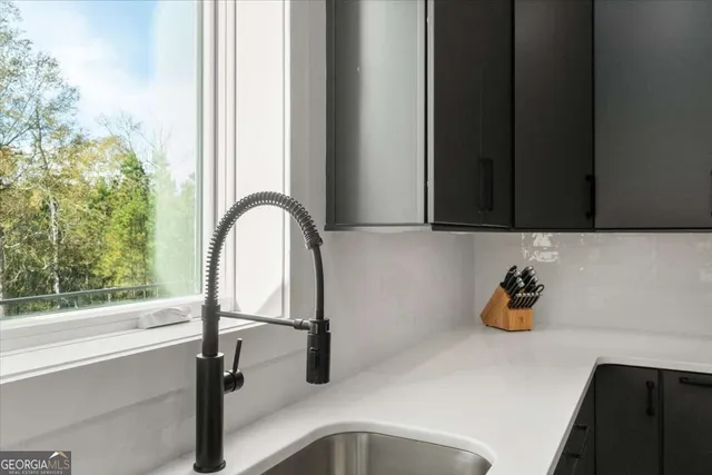 a bathroom with a sink and a window