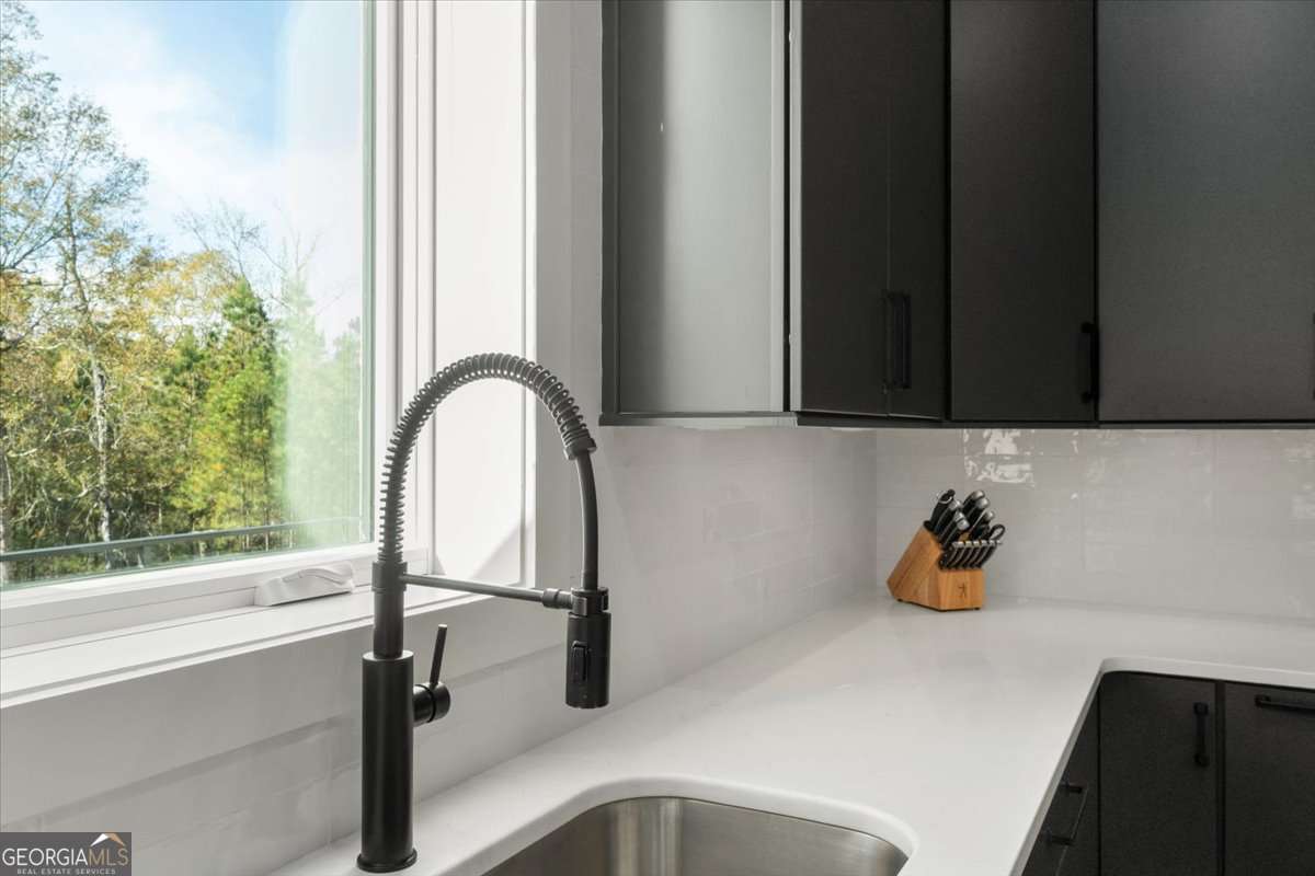 60 Stephens Road Lexington, GA 30648 - Photo 15 of 60 a bathroom with a sink and a window