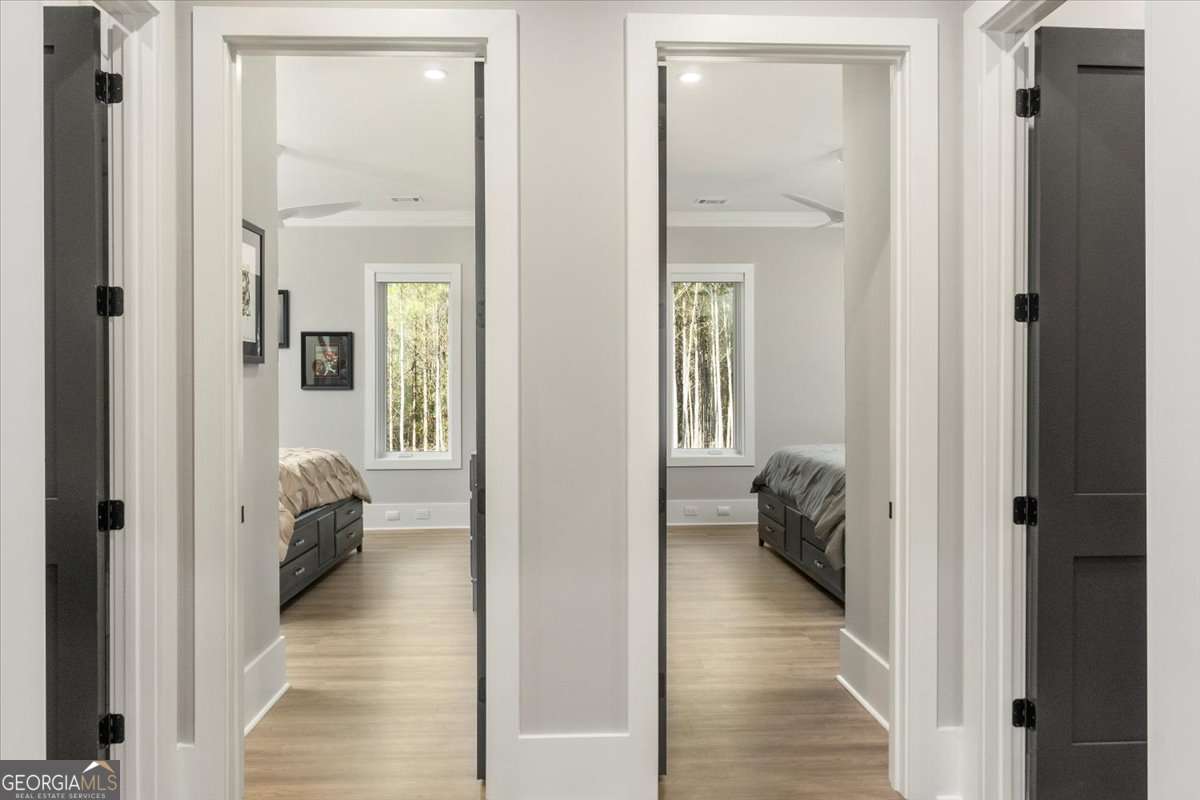 60 Stephens Road Lexington, GA 30648 - Photo 22 of 60 a view of a hallway with wooden floor and a bedroom