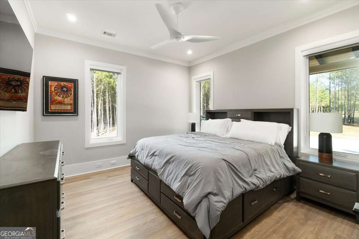 60 Stephens Road Lexington, GA 30648 - Photo 23 of 60 a bedroom with a bed lamp and a window