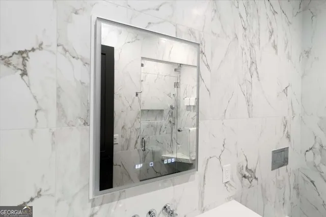 a view of an empty room with closet and a window