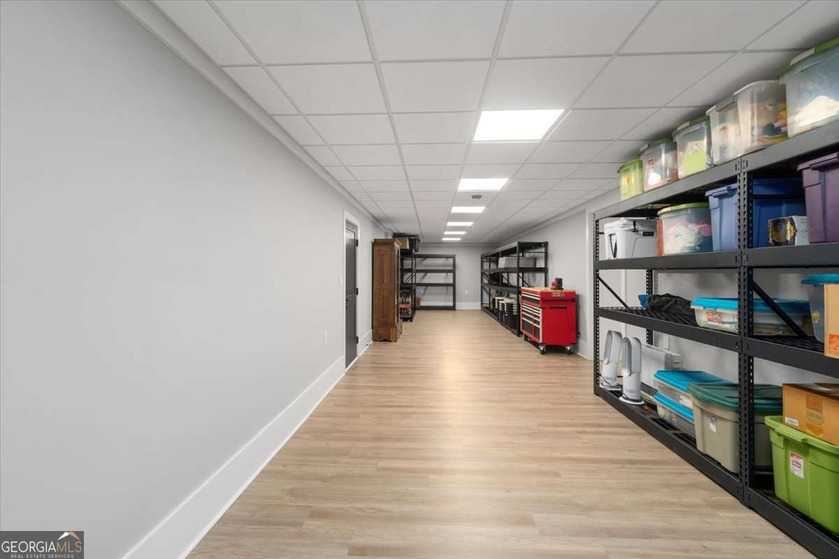 60 Stephens Road Lexington, GA 30648 - Photo 37 of 60 a room with lots of wooden furniture and a book shelf